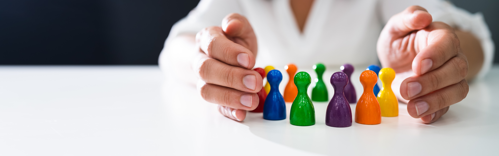 An image of board game pieces representing inclusivity